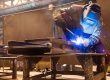 Welder at Work With Industrial Welding Helmet | Elite Welding & Fabrication