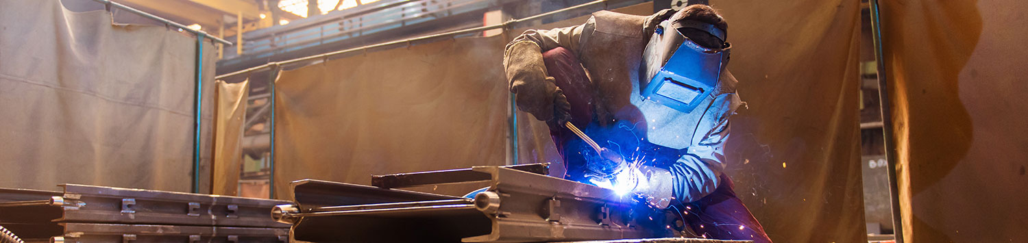 Man Welding In Shop | Elite Welding & Fabrication