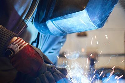 mig-welding Man providing onsite welding services with a MIG welding gun to repair an item | Elite Welding & Fabrication