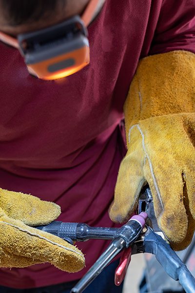 Man using TIG Welding Gun To Repair Item | Elite Welding & Fabrication