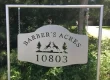 A custom designed metal road sign for Barber's Acres.