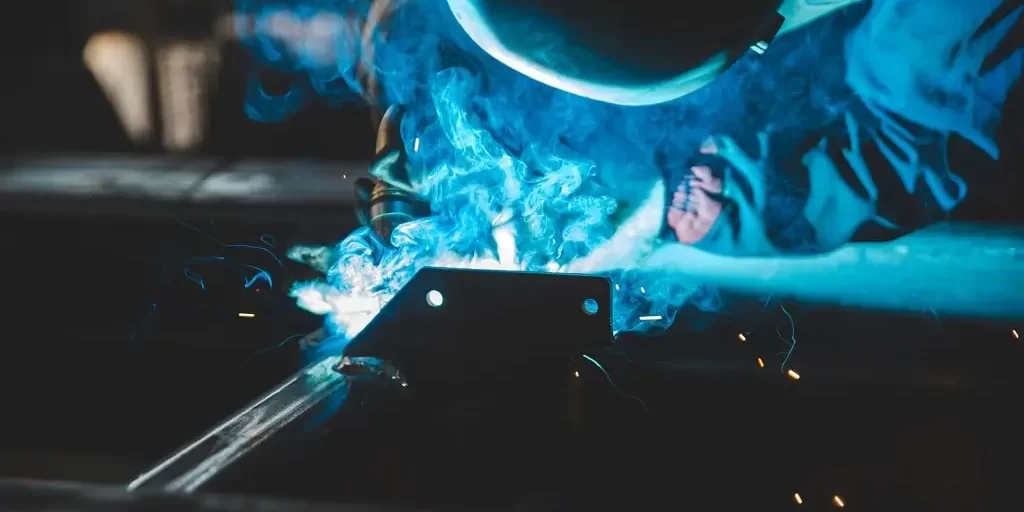 light-shining-in-the-dark-2023-11-27-05-31-08-utc-min A welder is illuminated by the glow made by their MIG welding.