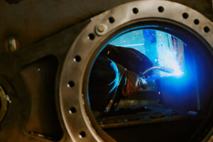 Hands Of Unrecognizable Welder while they are welding.