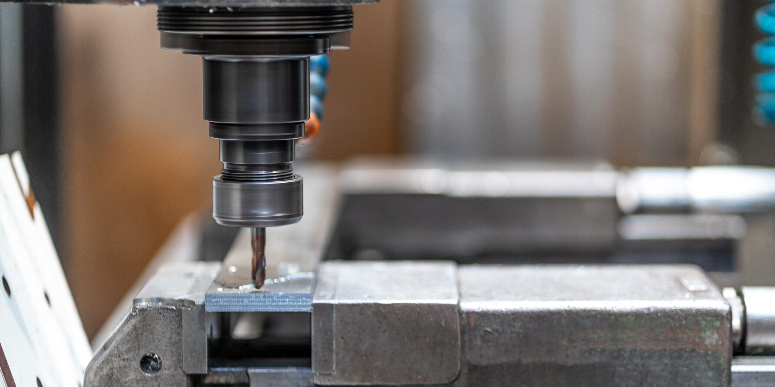 Machines from the metal industrial factory in the numerical control sector, high-tech milling machine that cuts metal with liquid coolant.