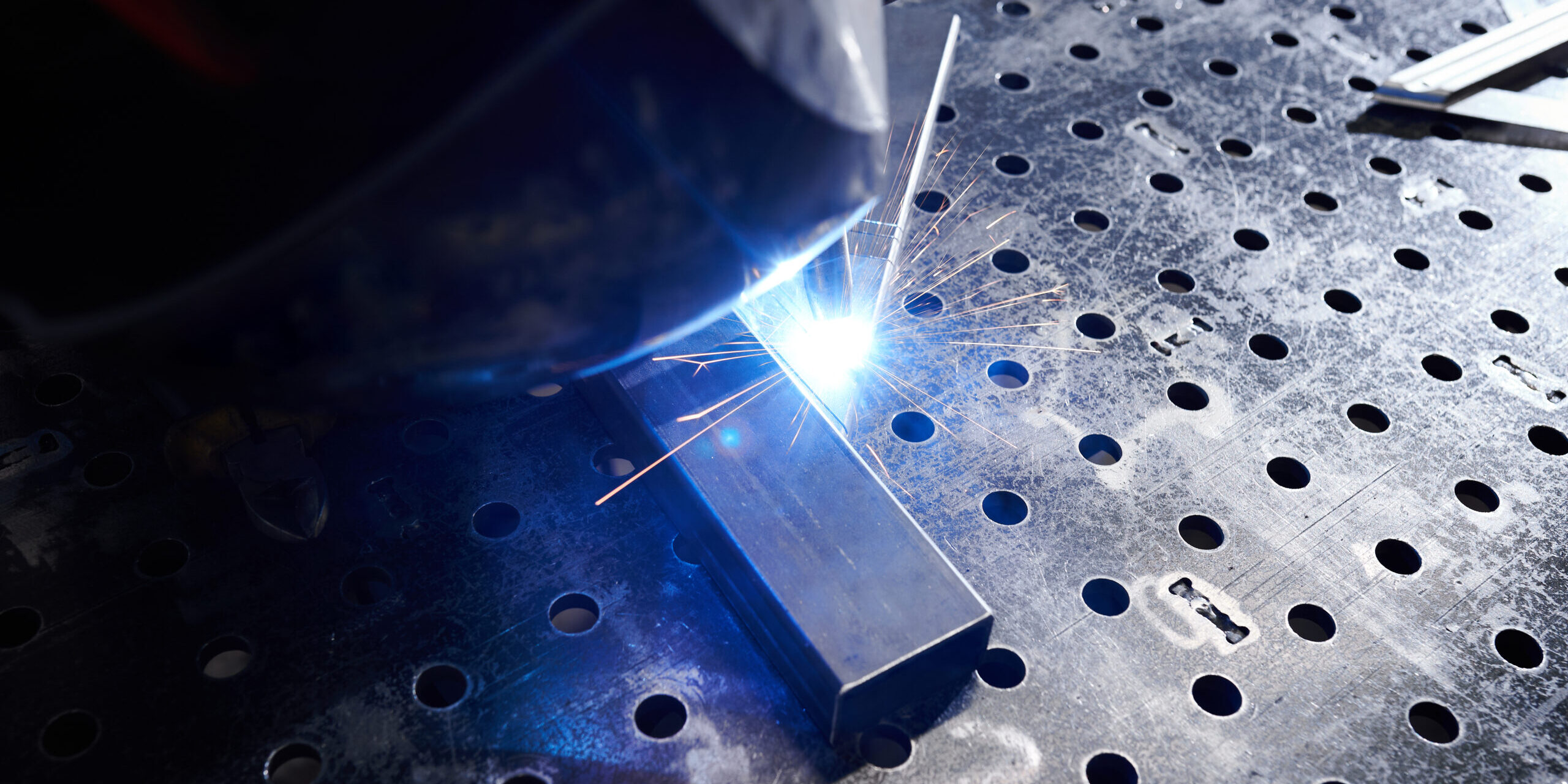 welding-metal-sparks-in-industrial-setting-2026-01-11-09-26-22-utc laser welding sparks