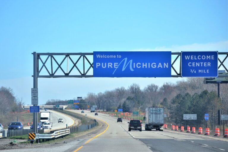 traveling-on-the-interstate-with-road-signs-welcom-2026-09-23-04-50-08-utc